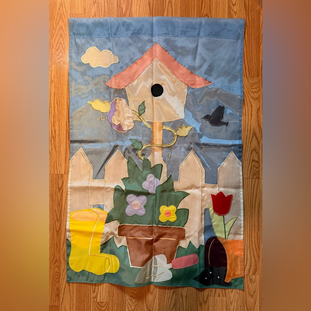 Springtime decorative garden flag, likely made of weather-resistant fabric